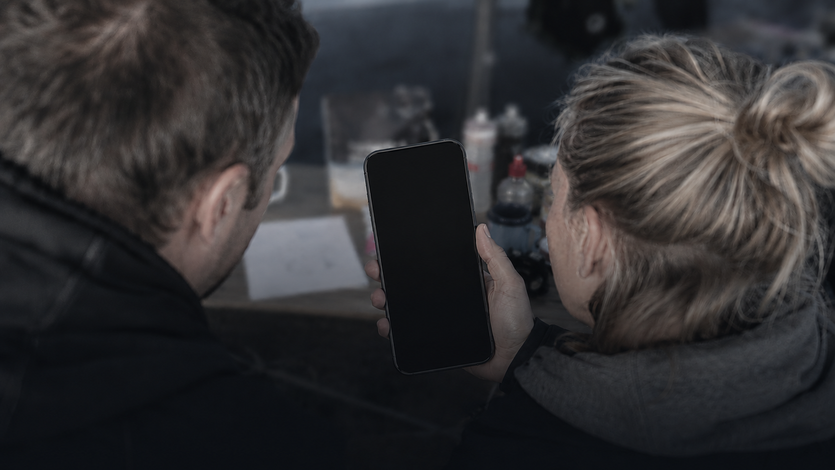 Crew member using phone to set up BackyardPace before a race
